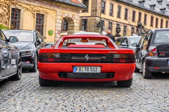 GERMANY, FULDA - JUL 2019: red FERRARI TESTAROSSA Type F110 coupe is a 12-cylinder mid-engine sports car manufactured by Ferrari, which went into production in 1984