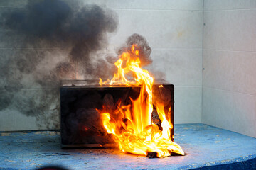 microwave oven on fire. the concept of fire in the kitchen and malfunctions, breakdowns of...
