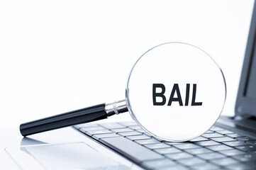 Bail text inside the magnifier. magnifying glass on white background