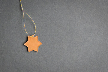 Star shape tag on grey background. Copy space. Template or mockup for text.