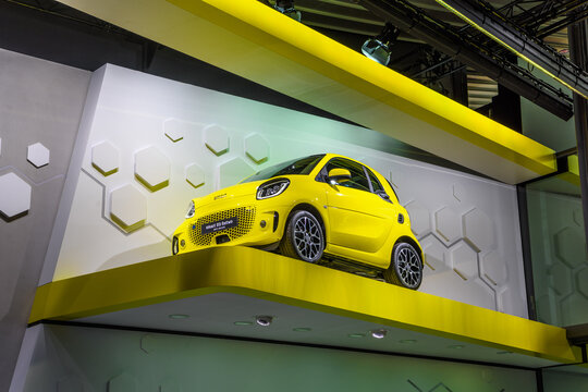 FRANKFURT, GERMANY - SEPT 2019: yellow SMART EQ FORTWO small electric car from MERCEDES-BENZ, IAA International Motor Show Auto Exhibtion