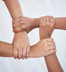 Hands, collaboration and joined people holding hands for unity, solidarity and connection. Community, support and teamwork with colleagues working together. Union, partnership and motivated people