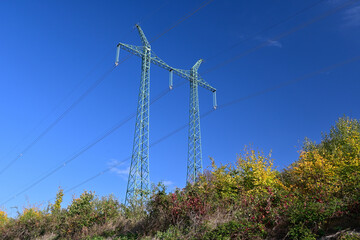 Obraz premium High voltage transmission line. Landscape with pylons for high voltage transmission line in the Czech Republic.