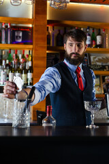 Bartender serve cocktail drink for customer at the bar