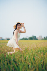 girl walking on rice fields