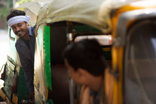 Auto drivers talking among themselves at auto stand