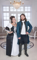 Beautiful couple woman and man in medieval clothes