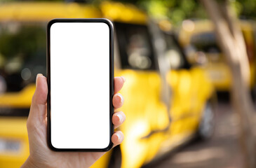 female hand hold phone with isolated screen background yellow taxi