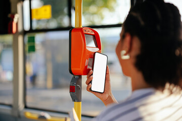 Woman using phone for contactless payment