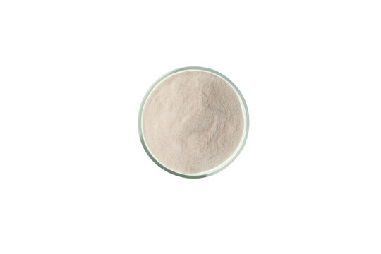 Malic acid or oxyantaric acid powder in Petri dish on white background, top view. Food additive E296, preservative used in the preparation of soft drinks and confectionery. Chemical formula C4H6O5