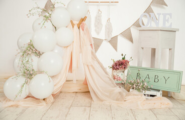 pink and white decoration for a 1st birthday cake smash studio photo shoot with balloons, paper...