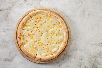 Fresh hot cheese pizza on the concrete background