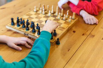 Two school boys playing chess - obrazy, fototapety, plakaty