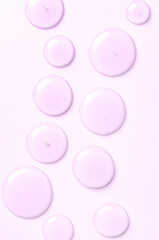 Pink drops of moisturizing gel or serum. Cosmetic product for skin care