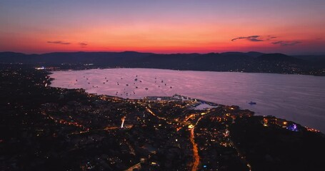 Aerial view of Saint-Tropez during sunset. St. Drone flies over the harbor of France Mediterranean Azur.