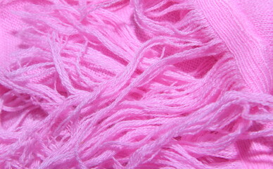 Texture of pink knitted knitted scarf with dyed rabbit fur