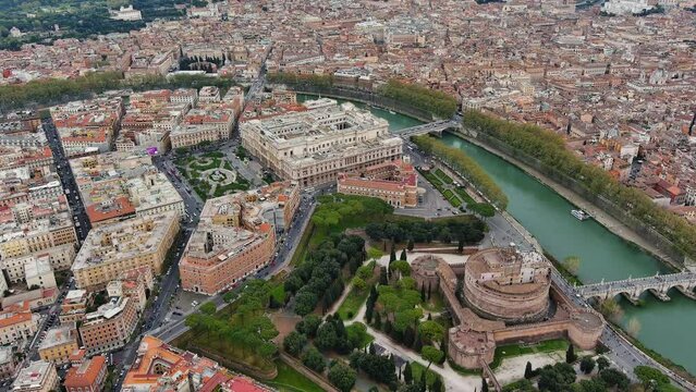 Aerial view Rome city skyline ft. famous historic landmarks, The Mausoleum of Hadrian (Castel Sant'Angelo) and drone shot Supreme Court of Cassation (Corte suprema di cassazione) by River Tiber, Italy