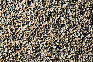 Gravel texture. Stones background. Rocks pattern. Little stones background. Gray noise backdrop. Pebble texture. Pile of rocks. Rocky beach backdrop.
