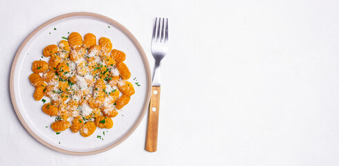 Pumpkin gnocchi with Parmesan cheese and herbs. Healthy eating. Vegetarian food.
