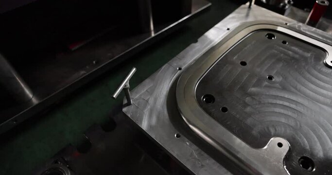 Sheet Metal Stamping Tool Die for Automotive Precision Parts on The Numerical Control Milling Machine Table. Tandem Stamping System. At a High Quality Technology Factory. Black and White Photography.
