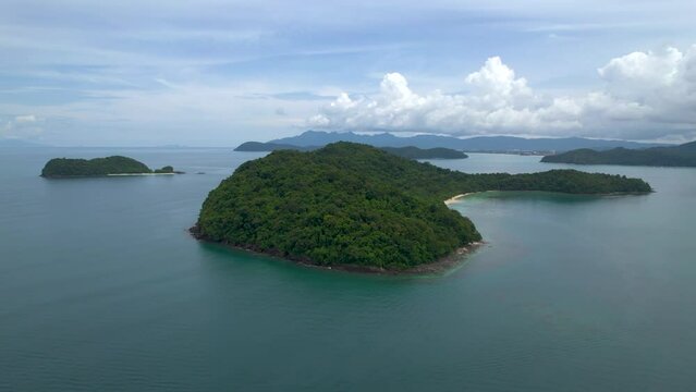 Beautiful scenic drone flight around Beras Basah Islands, archipelago in Malaysia. 