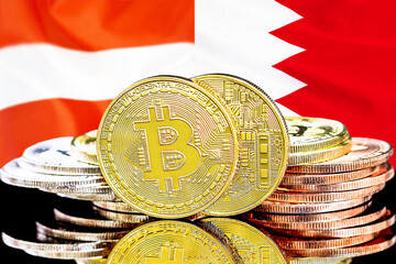 Bitcoins on flag Bahrain and Austria background. Concept for investors in cryptocurrency and Blockchain technology in Bahrain and Austria