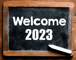 welcome 2023 on a chalk board