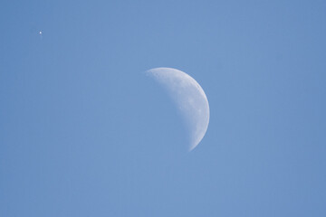 balloon near the moon during daylight