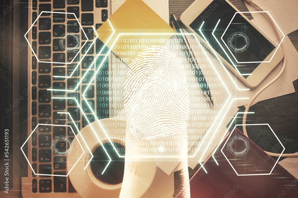 Poster Finger print over computer on the desktop background. Top view. Double exposure. Concept of securitization.
