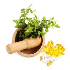 Mortar with fresh green mint and pills on white background, top view