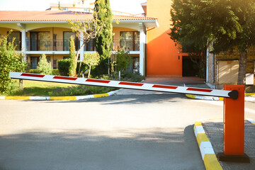 Automatic boom barrier on sunny day outdoors