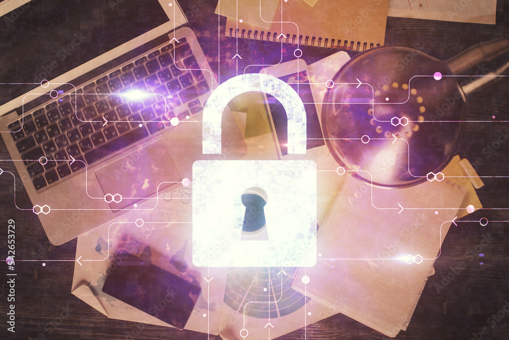 Poster Double exposure of lock hologram drawing over study table background with computer. Concept of data security. Top view.