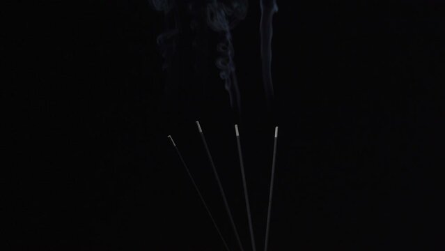burning a agarbatti in baground dark place