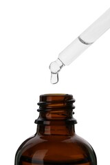 Dripping medical product from pipette into glass bottle isolated on white, closeup