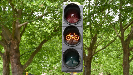 Cyclist orange light on traffic light.  