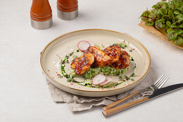 Portion of grilled chicken breast with risotto