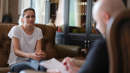 Young woman talk to psychologist at therapy session