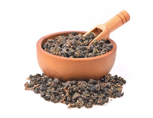 Chinese oolong tea Tie GuanYin in wooden bowl and spoon on white background.