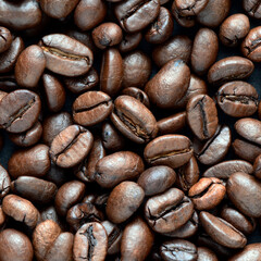 Fresh coffee beans scattered as a background or texture.