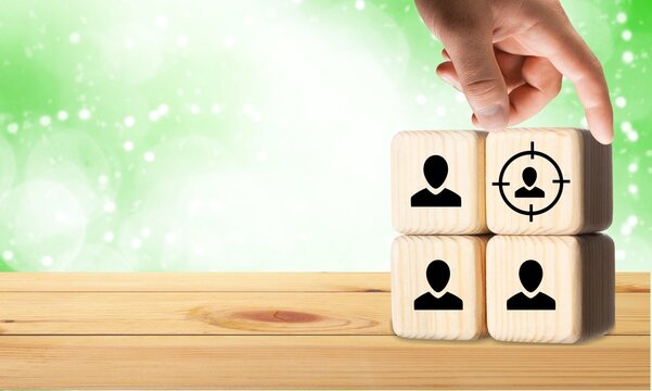 Wooden blocks or cubes with symbols on the desk.