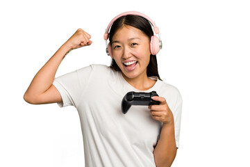 Young asian gamer woman playing with a game controller and headphones isolated - obrazy, fototapety, plakaty