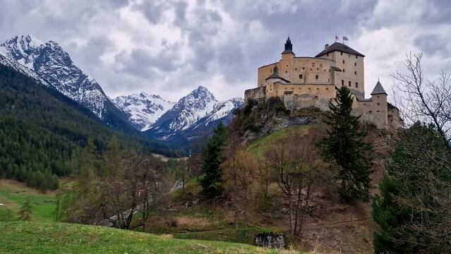 Impressive mountain scenery with amazing medieval castle Tarasp surrounded by Swiss Alps, Canton Grisons or Graubuendon, Switzerland