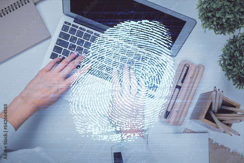 Poster Double exposure of woman hands working on computer and fingerprint hologram drawing. Top View. Digital Security concept.