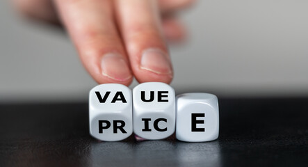 Hand turns dice and changes the word price to value.