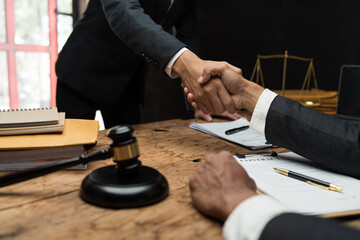 Shaking hands after agreement, A legal consultation is the initial meeting between a potential lawyer and client.