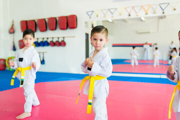 Children making eye contact while doing karate