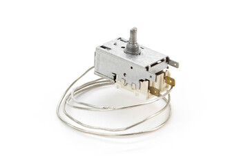 Refrigerator thermostat. Spare parts for the refrigerator. Closeup. Isolated on a white background