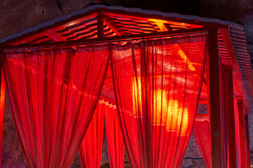 Chinese-style red tents and festive chandeliers built for weddings indoors