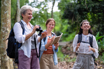 Backpack tourist travel outdoor adventure bird study using binoculars looking and record to book