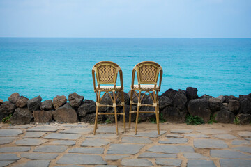 a chair overlooking the sea